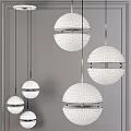 Modern Spherical Pendant Lights With White Shades And Black Metal Frames For Contemporary Interior Spaces