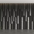 Modern Accent Wall with Vertical Textured Black and Gray Panels and Potted Green Plant