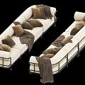 White Sectional Sofa with Brown Cushions and Gray Throw Blankets and Metal Legs