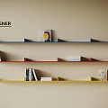 Designer Colorful Wall Shelves with Books and Decor Items on Beige Wall