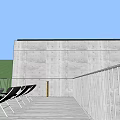 Modern Concrete Building Exterior With Large Windows Balconies And Green Lawn