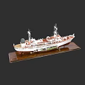 Detailed Warship Model With White Red Hull On Wooden Display Base