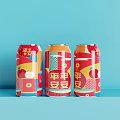 Three Colorful Beverage Cans With Festive Decorative Patterns On Blue Background
