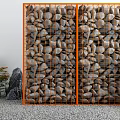 Courtyard Garden Featuring Orange Metal Grid Screen Stones Rock Formations Green Plants On Gravel Ground