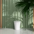 Modern White Toilet Design In Green Interior With Natural Light And Shadow