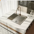 Modern Stainless Steel Washbasin with Brass Faucet and Glass Cups on White Countertop