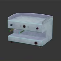 Stainless Steel Countertop Kitchen Appliance With Control Knobs And Smooth Surface