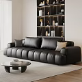 Modern Large Black Leather Sofa With Pillows In Living Room Glass Coffee Table And Bookshelf