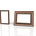 Two Different Styles of Wooden Picture Frames Displayed on White Background with Reflection