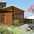 Wooden Vacation Rental Building With Deck Green Plants Outdoor Seating And Pink Flowering Tree