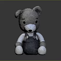 Adorable Gray Knitted Teddy Bear With White Paws And Blue Overalls Design
