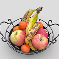 Black Wrought Iron Basket Filled With Fresh Bananas Apples And Oranges