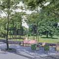 Scenic Camping Site With Lush Trees Green Grass Stone Paths Wooden Walkway And Fire Pits