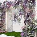 Floral Decorated Event Entrance Arch With Purple Pink Flowers And Green Grass