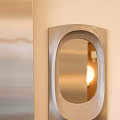 Stylish Modern Mirror With Unique Metal Frame Reflecting Warm Light On Light Beige Wall