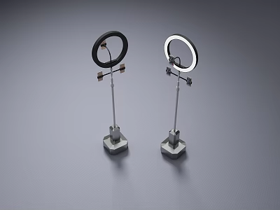 Black And White Ring Lights With Stands And Bases On Gray Surface 3d model