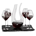Elegant Wine Decanter And Red Wine Glasses With Red Wine On Black Slate Tray