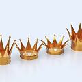Four Different Sizes Golden Crowns Jewelry Arranged in a Row with Spiked Design