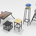 Rustic Wooden Table With Black Frame Stools And Pedestals With Vases And Blue Flowers