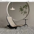 Modern Lounge Chair With Circular Wall Decoration Pendant Light Green Plant And Textured Rug