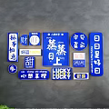 Blue Chinese Decorative Plaques With Lucky Phrases On Gray Wall