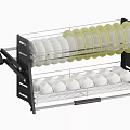 Kitchen Dish Drying Rack With Layers Holding White And Green Rimmed Plates And Bowls