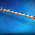 Classic Vintage Rifle With Wooden Stock And Metal Parts Displayed On Blue Background