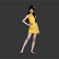Woman In Yellow Silk Cheongsam With Bun Hairstyle Barefoot Against Gray Background