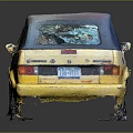 Yellow Vintage Two Door Car With Gray Roof And Reflective Black Surface