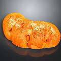 Freshly Baked Golden Curved Bread With Sesame Seeds And Shiny Crust