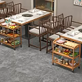 Functional Dining Tables With Circular Hot Pot Area And Wheeled Food Carts In Restaurant