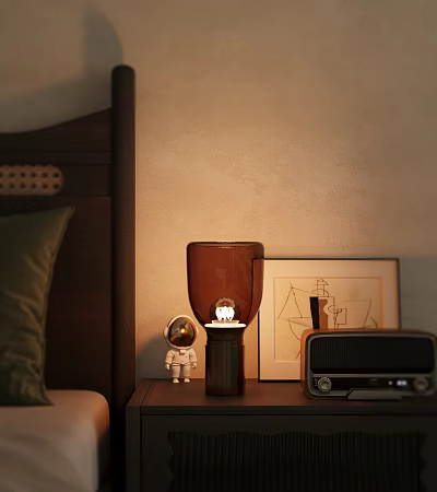 Warm Light Table Lamp On Bedroom Bedside Table With Astronaut Figurine Radio And Picture Frame 3d model