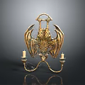 Golden Bat Wing Candelabra With Ornate Design And Two Candles