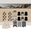 Display of Luggage and Backpacks on Wooden Pegboard with Mountain Backdrop and Canvas Tent