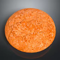 Round Orange Baked Pastry With Speckled Sugar Topping On Surface