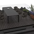 Wooden Deck With Long Table Wicker Chairs Green Plants Flowers And Glass Railing