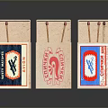Three Vintage Matchboxes With Colorful Labels And Distinct Designs On Reflective Surface