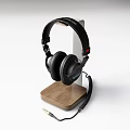 Stylish Black Over Ear Headphones With Wooden Stand And Coiled Audio Cable