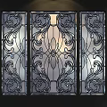 Stained Glass Windows With Intricate Floral Patterns And Decorative Metal Frames