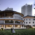 Modern Architectural Exterior Wall With Circular Structure Large Glass Windows And Traditional Tile Roof