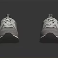 Pair of Gray Sneakers with White Laces and Modern Rubber Sole Casual Style