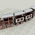Wooden Toy Train With Brown And White Carriages On Patterned Floor