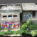Graffiti Covered Concrete Building With Metal Fence Stairs And Overgrown Greenery