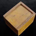Vintage Yellow Square Wooden Box With Worn Surface On Black Background