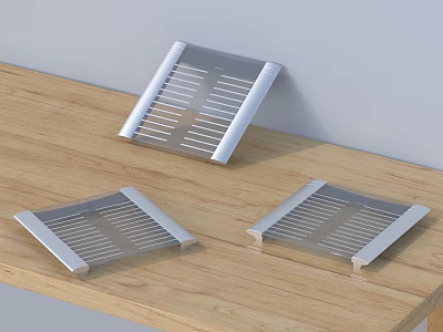 Three Square Metal Kitchen Dish Drainers On Wooden Tabletop With Striped Design 3d model