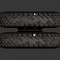 Pair of Off Road Tires with Deep Tread Pattern and Black Rims on Gray Background