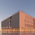 Modern Glass Building Exterior At Sunset With Cloudy Sky And Reflections