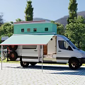 White Van With Green Rooftop Structure And Awning In Outdoor Setting With Trees And Grass