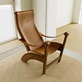 Modern Brown Leather Armchair With Wooden Frame In Bright Room With Wooden Floor