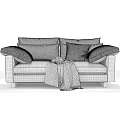 Gray Two Seater Sofa With Green Leaf Pattern Pillows Cozy Blanket And Wooden Legs